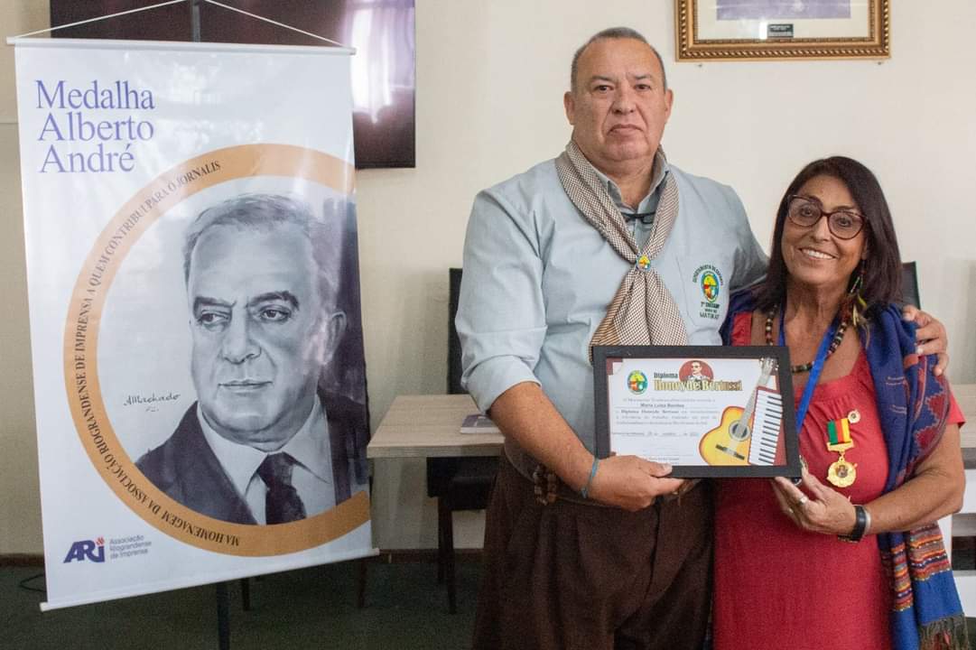 ​Em evento da ARI, MTG entrega diploma e medalha Honeyde Bertussi para Maria Luiza Benitez